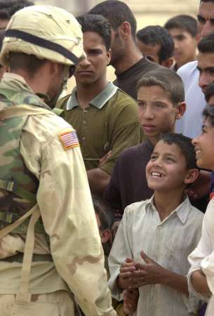 Iraqi boy speaks to GI.jpg